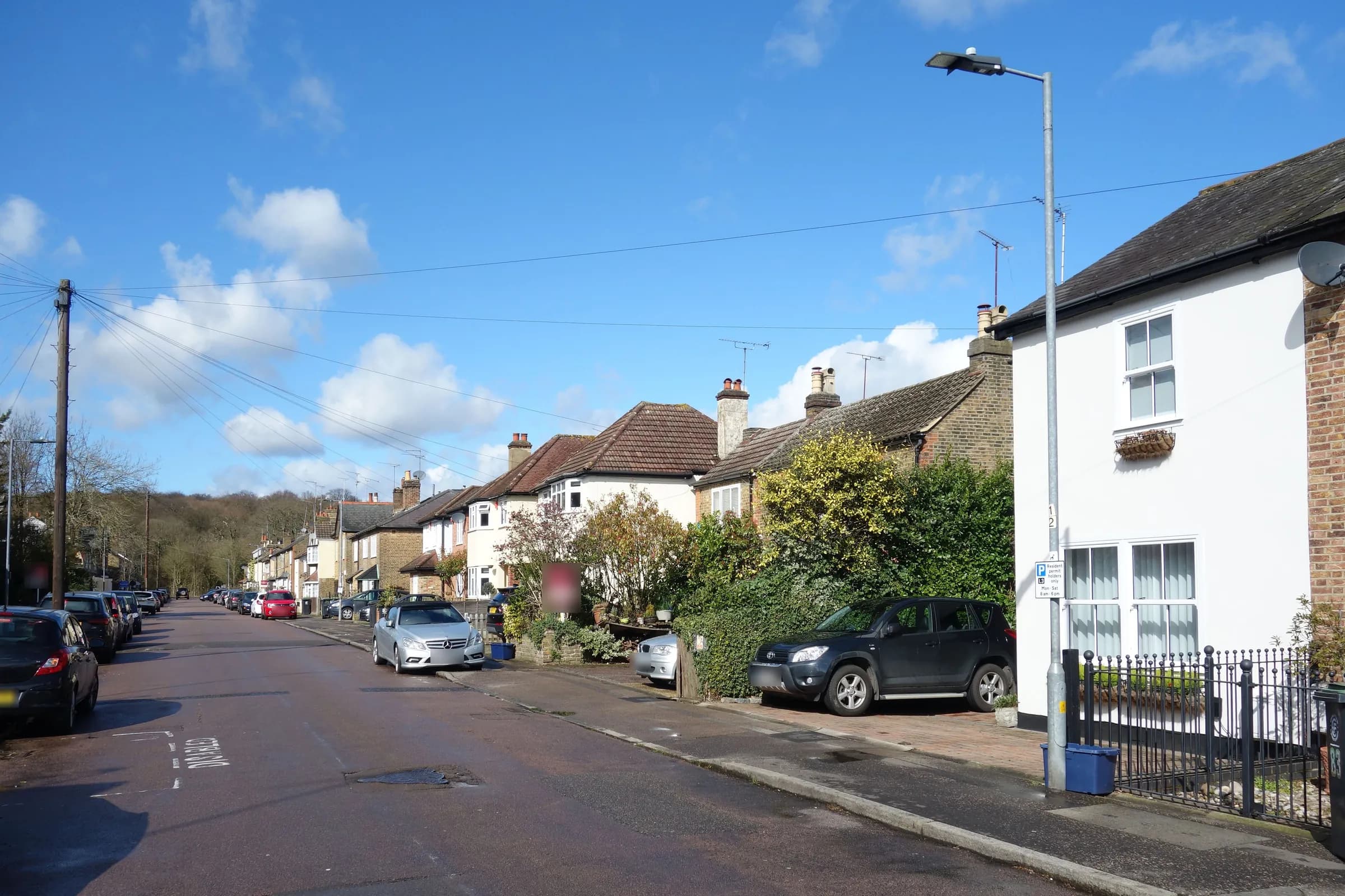 Forest Road in Loughton on a sunny day, with houses and trees